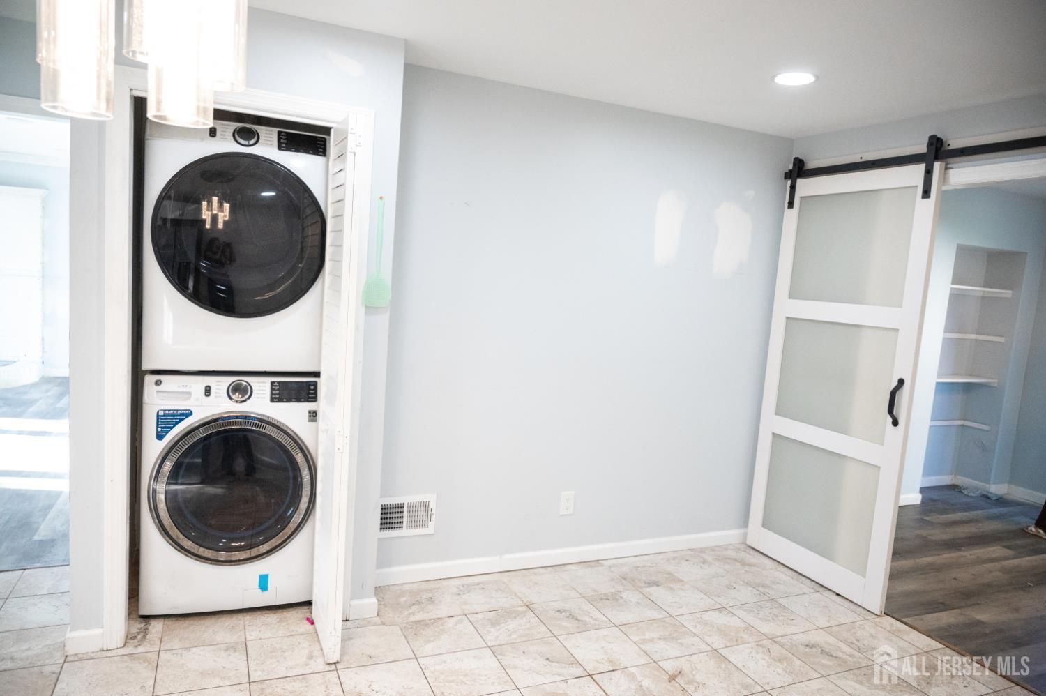 101 Perry Street Keyport, NJ 07735 - Photo 10 of 15 a view of a hallway with washer and dryer