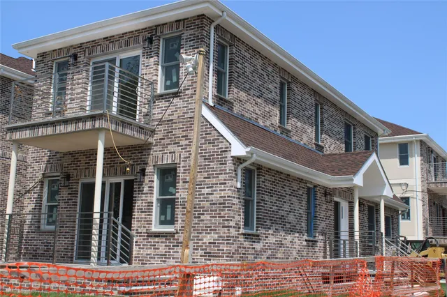 a front view of a house with glass windows