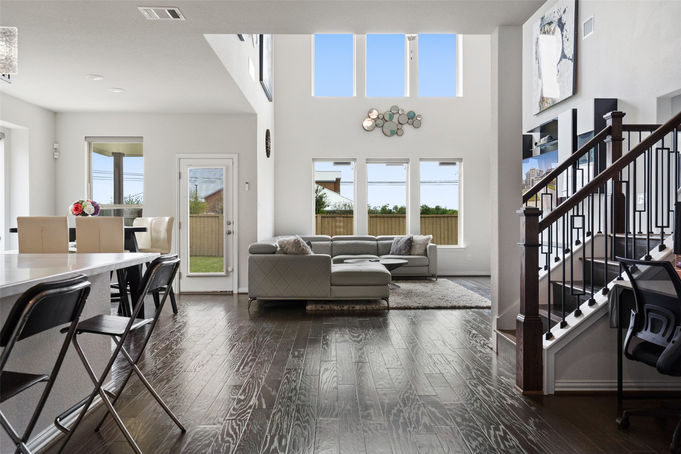 4101 Gildas Path Pflugerville, TX 78660 - Photo 6 of 16 Living room featuring dark wood finished floors and a high ceiling