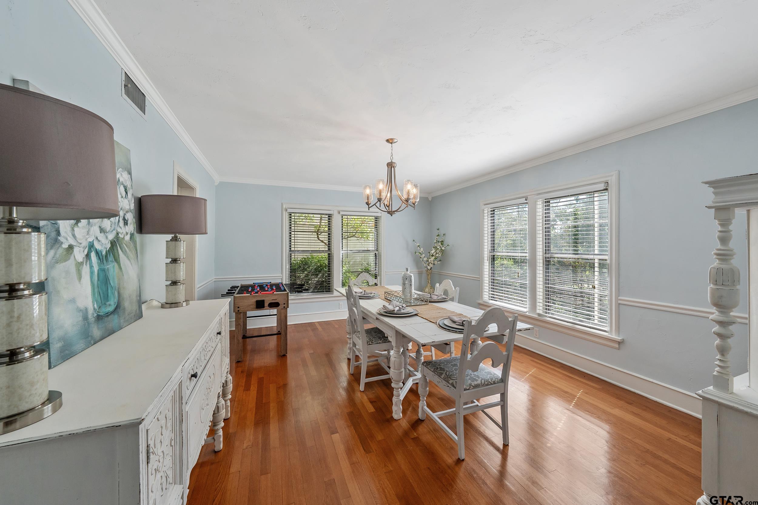 145 Rowland Place Tyler, TX 75701 - Photo 12 of 43 a dining room with furniture window and wooden floor