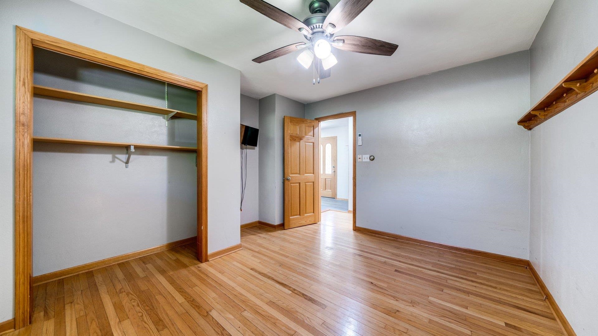 313 West Margaret Fuller Road Oregon, IL 61061 - Photo 21 of 46 a view of an empty room with wooden floor