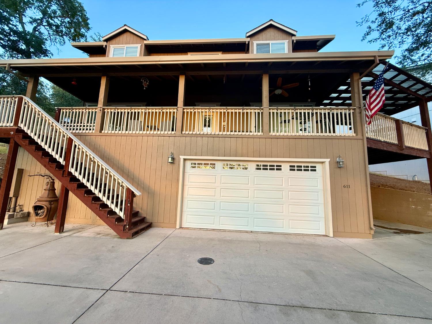611 Sunrise Road Copperopolis, CA 95228 - Photo 28 of 29 a front view of a house with a yard and balcony