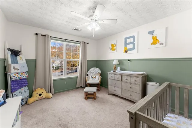 a bed room with furniture and a window