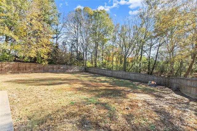 a view of a yard with a large trees