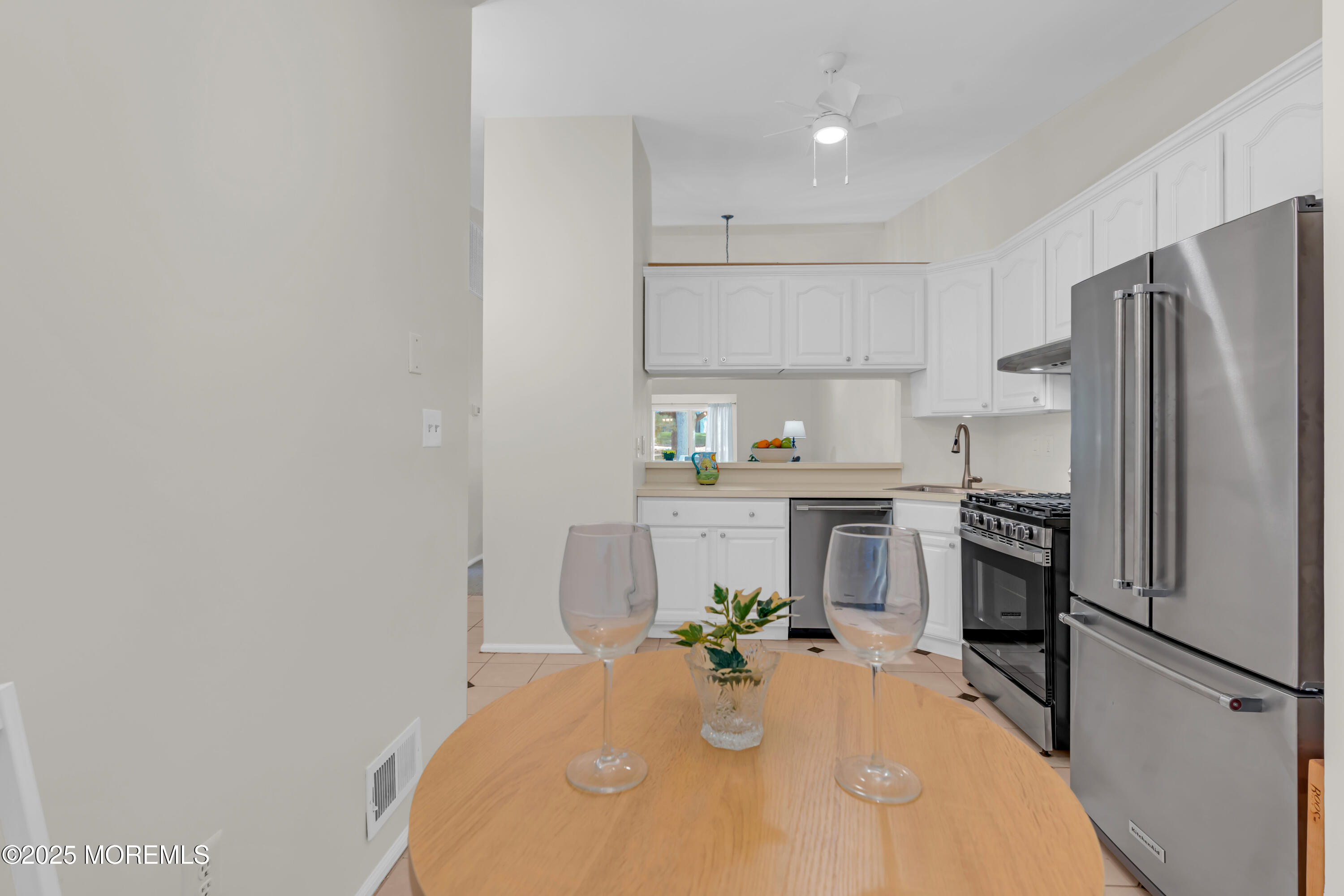 59 Boxwood Terrace Red Bank, NJ 07701 - Photo 12 of 46 a kitchen with a refrigerator and a stove top oven