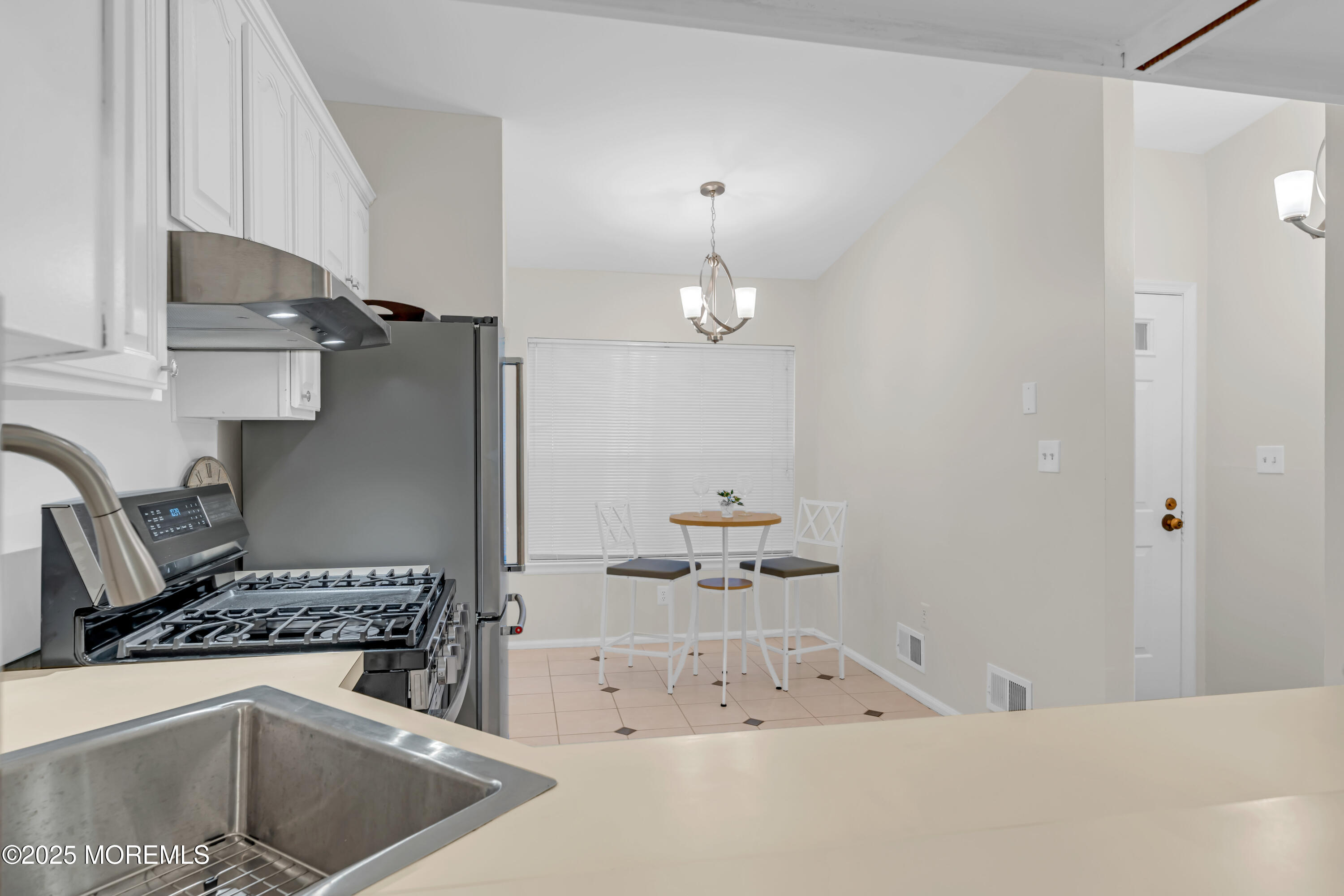 59 Boxwood Terrace Red Bank, NJ 07701 - Photo 13 of 46 a kitchen with stainless steel appliances a sink a stove and refrigerator