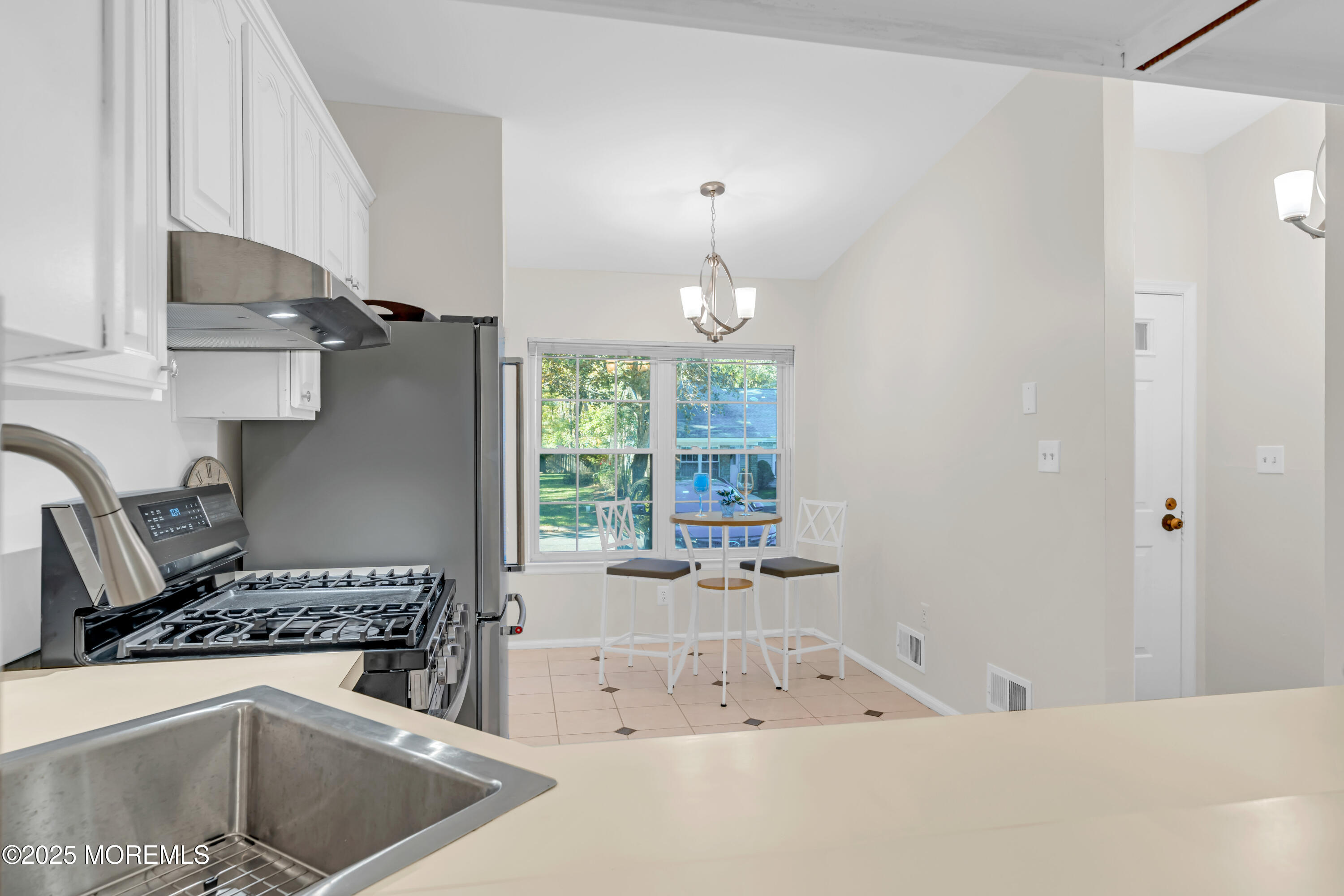 59 Boxwood Terrace Red Bank, NJ 07701 - Photo 14 of 46 a kitchen with a stove a sink and a refrigerator