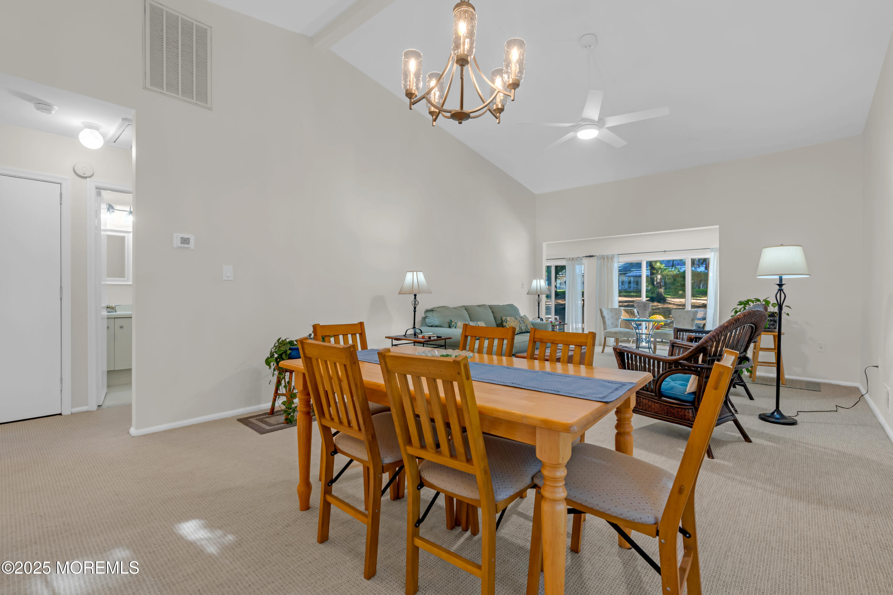 59 Boxwood Terrace Red Bank, NJ 07701 - Photo 16 of 46 a view of a dining room with furniture and chandelier