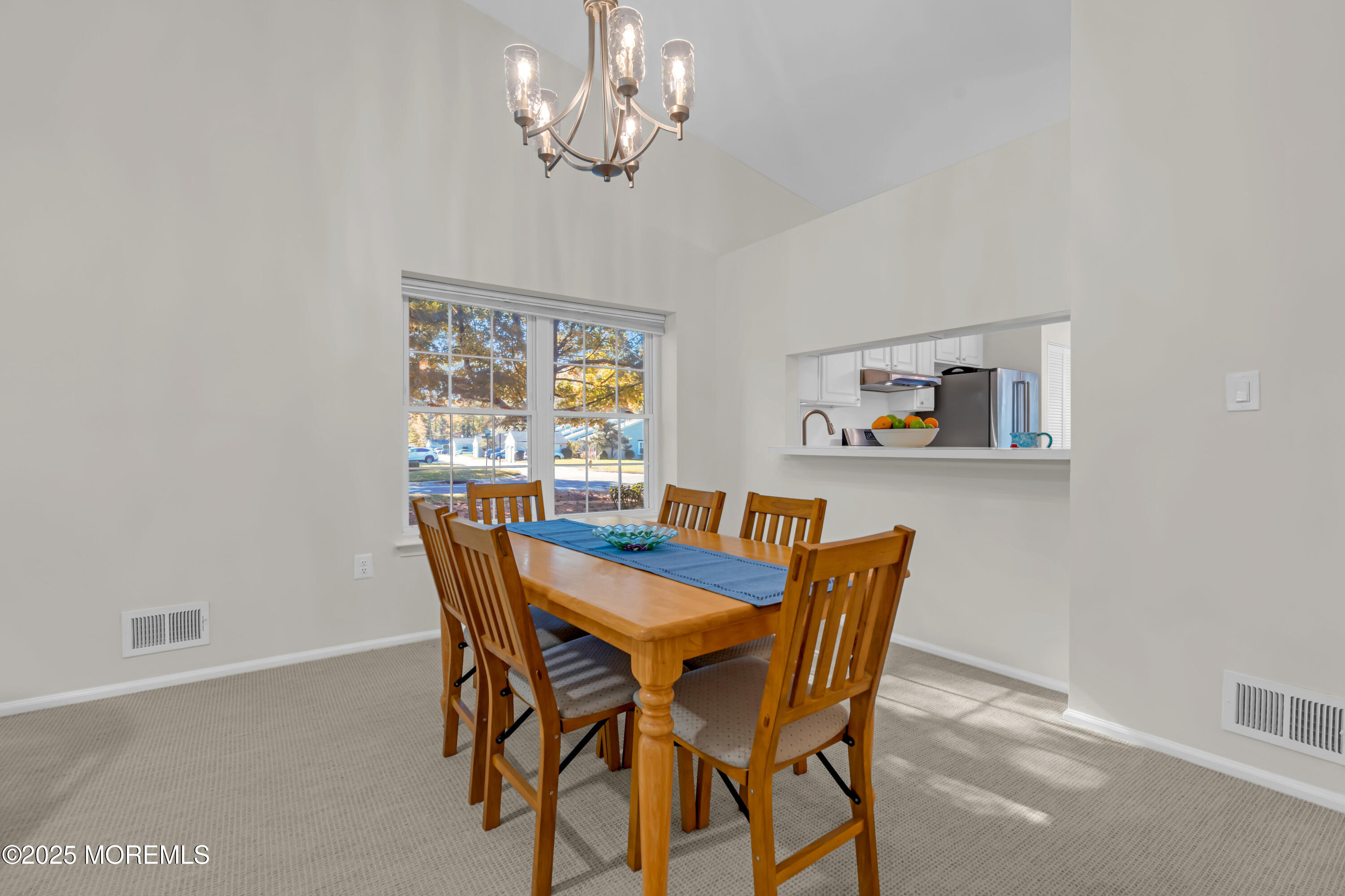 59 Boxwood Terrace Red Bank, NJ 07701 - Photo 18 of 46 a view of a dining room with furniture a chandelier and a window