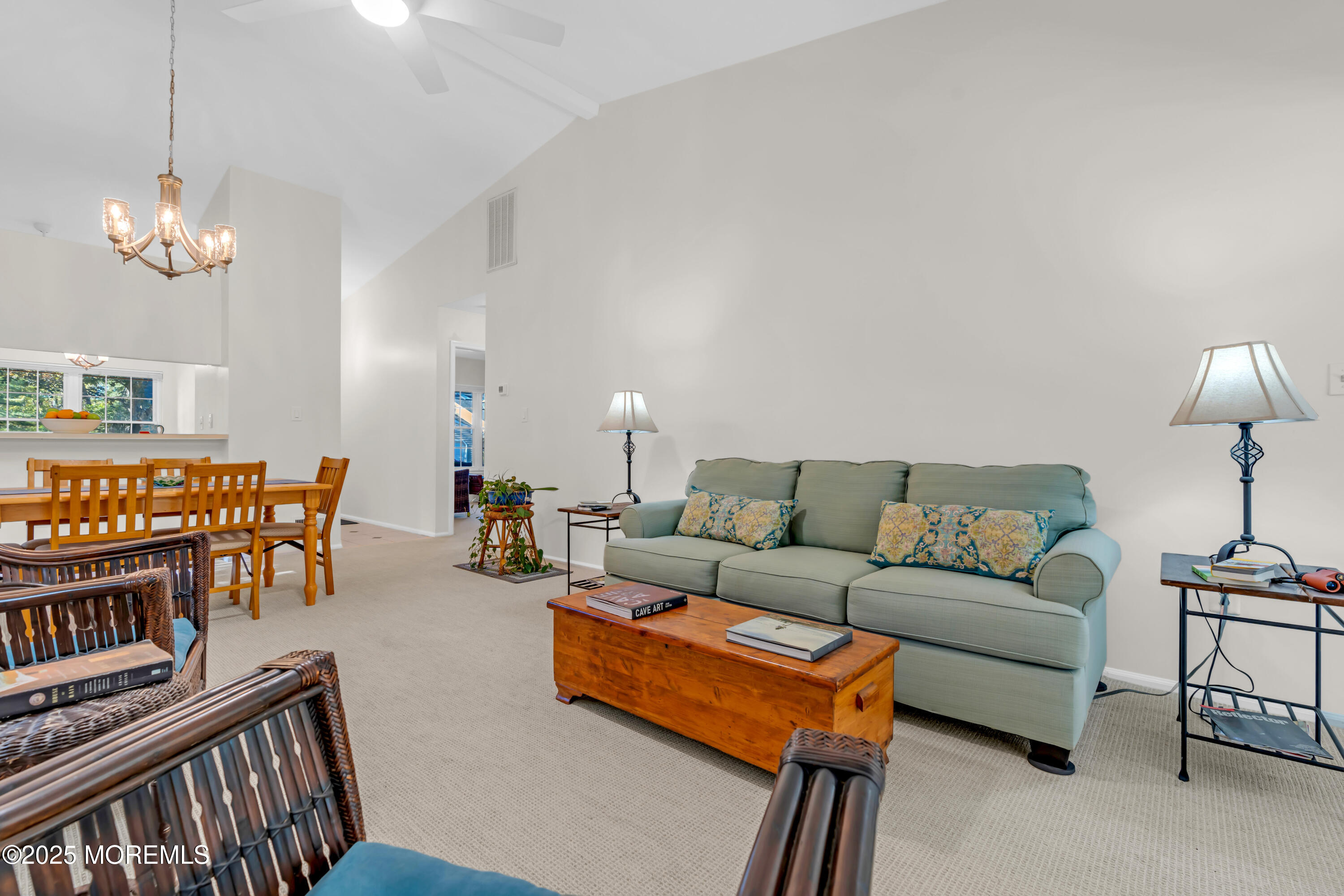 59 Boxwood Terrace Red Bank, NJ 07701 - Photo 21 of 46 a living room with furniture a chandelier and a dining table