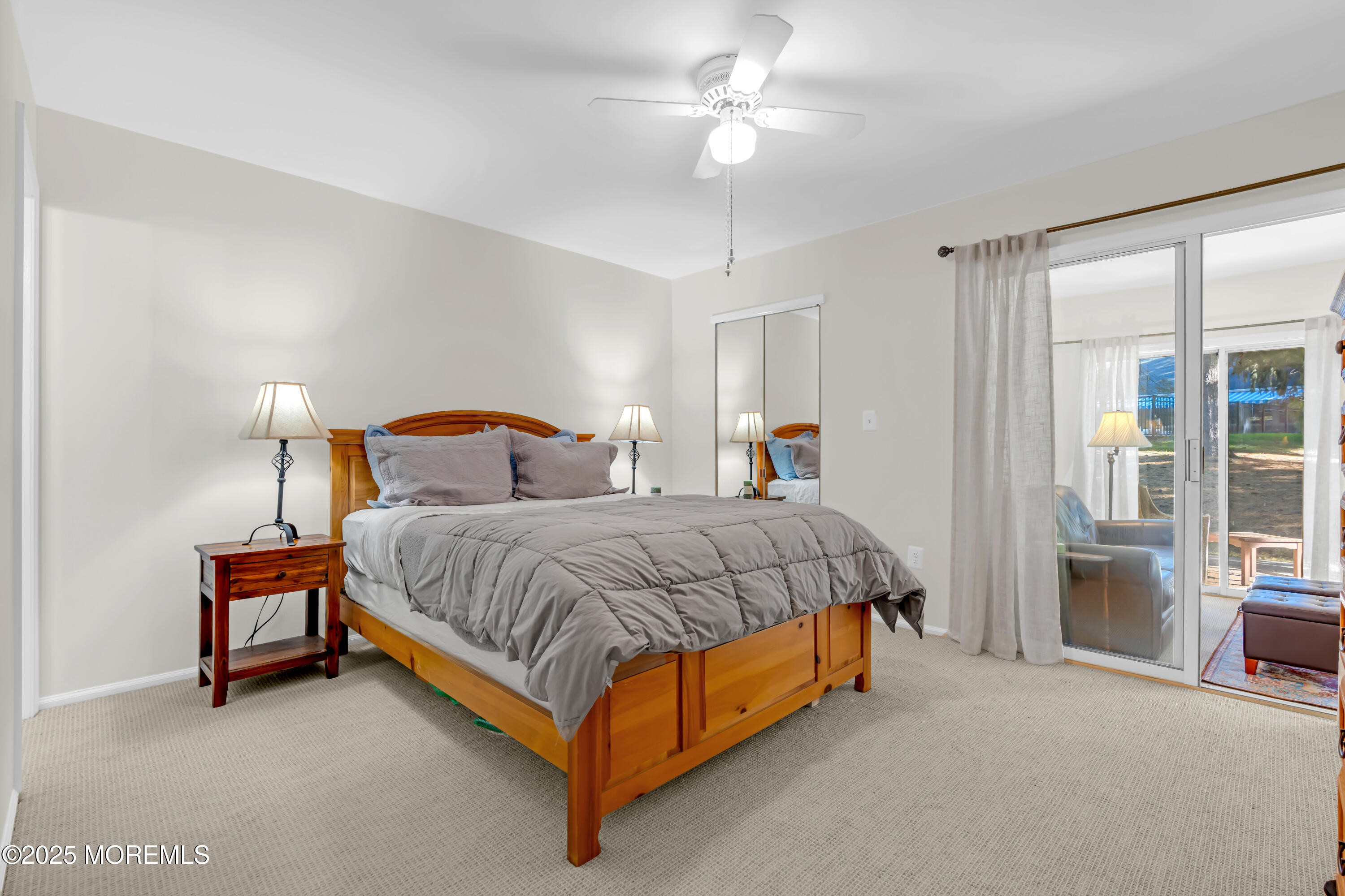 59 Boxwood Terrace Red Bank, NJ 07701 - Photo 28 of 46 a bedroom with a bed and a chandelier