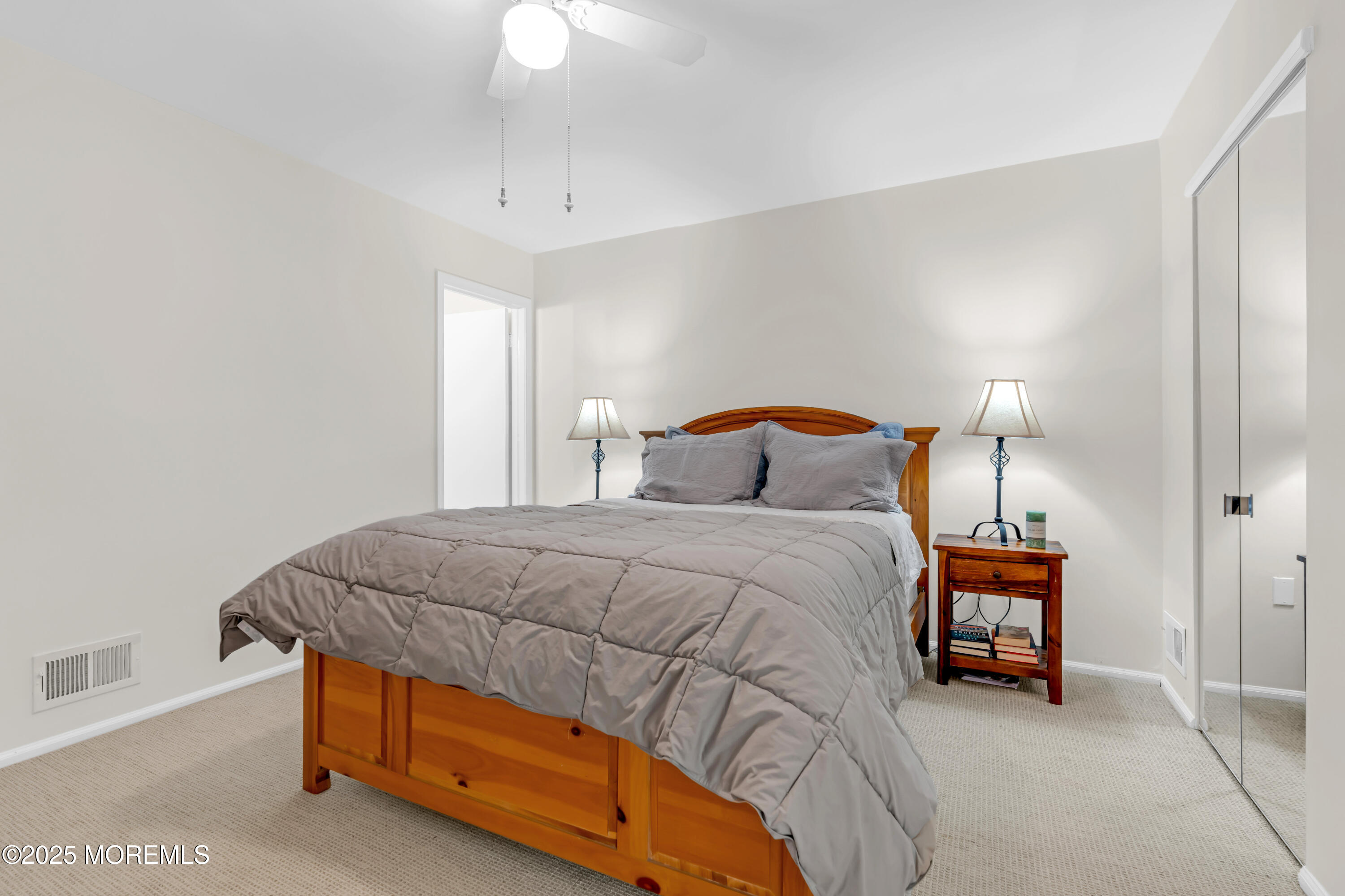 59 Boxwood Terrace Red Bank, NJ 07701 - Photo 29 of 46 a bedroom with a bed and a lamp