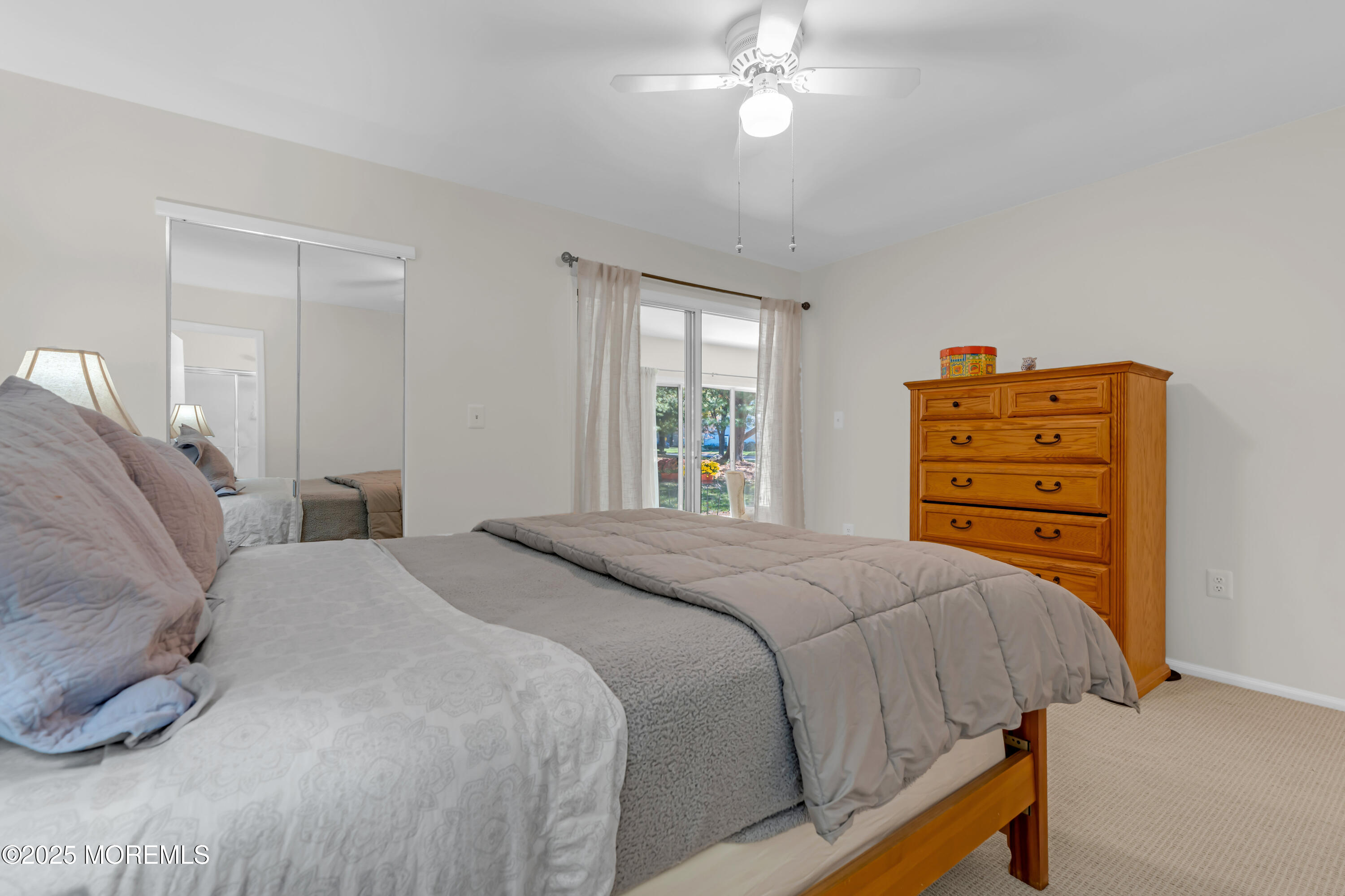 59 Boxwood Terrace Red Bank, NJ 07701 - Photo 31 of 46 a bedroom with a bed and a chandelier