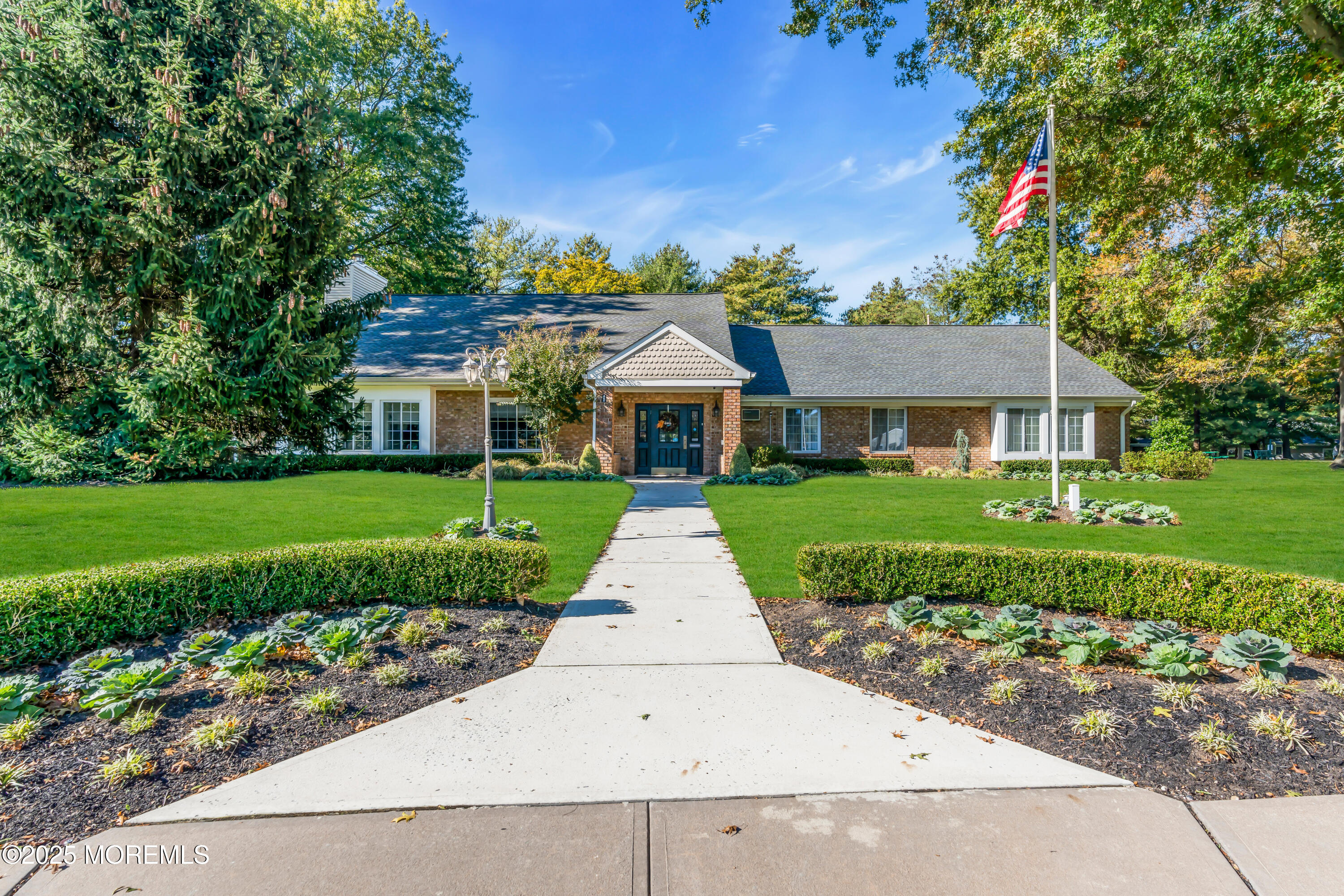 59 Boxwood Terrace Red Bank, NJ 07701 - Photo 42 of 46 a front view of a house with a garden
