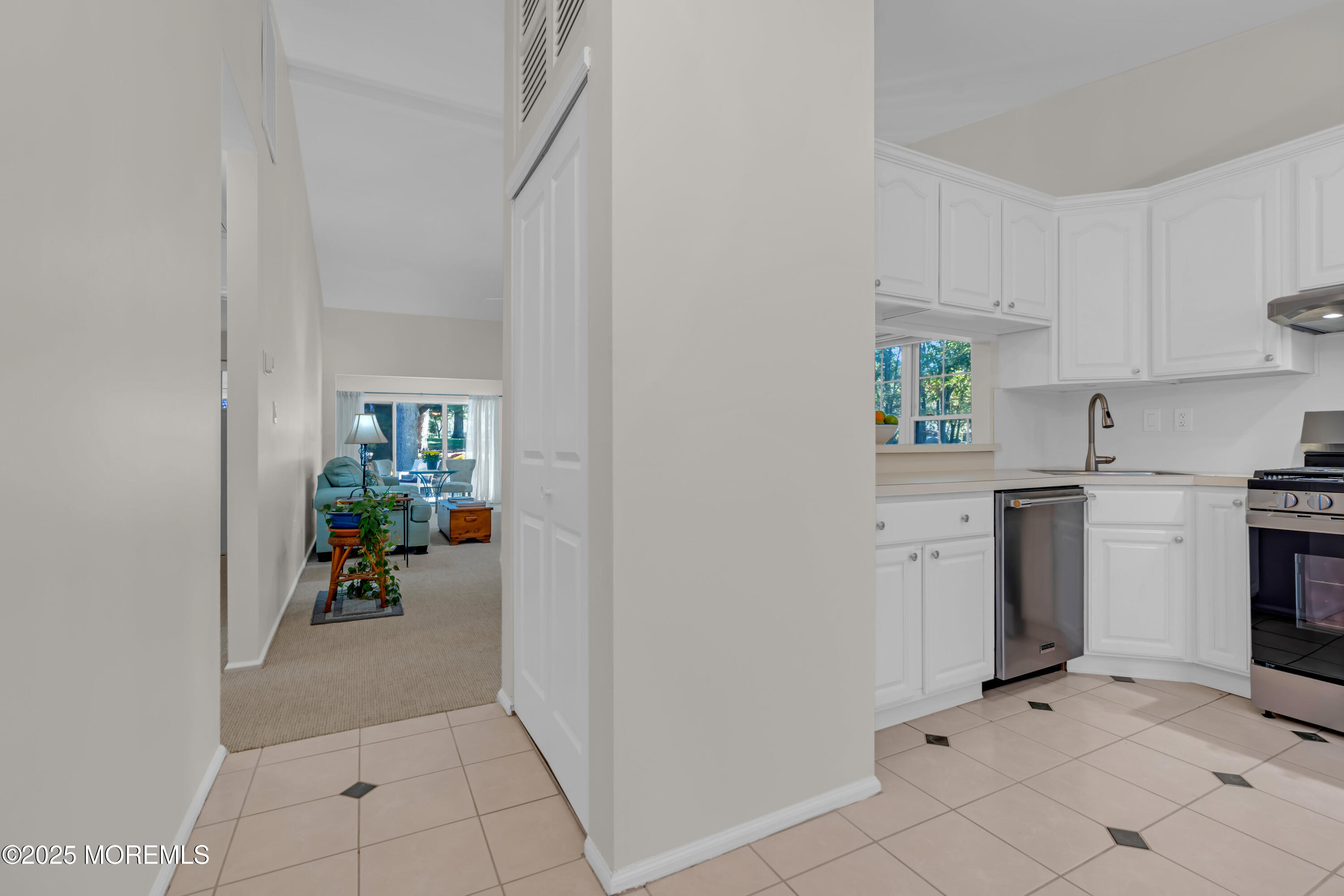 59 Boxwood Terrace Red Bank, NJ 07701 - Photo 7 of 46 a view of a kitchen with fridge and workspace