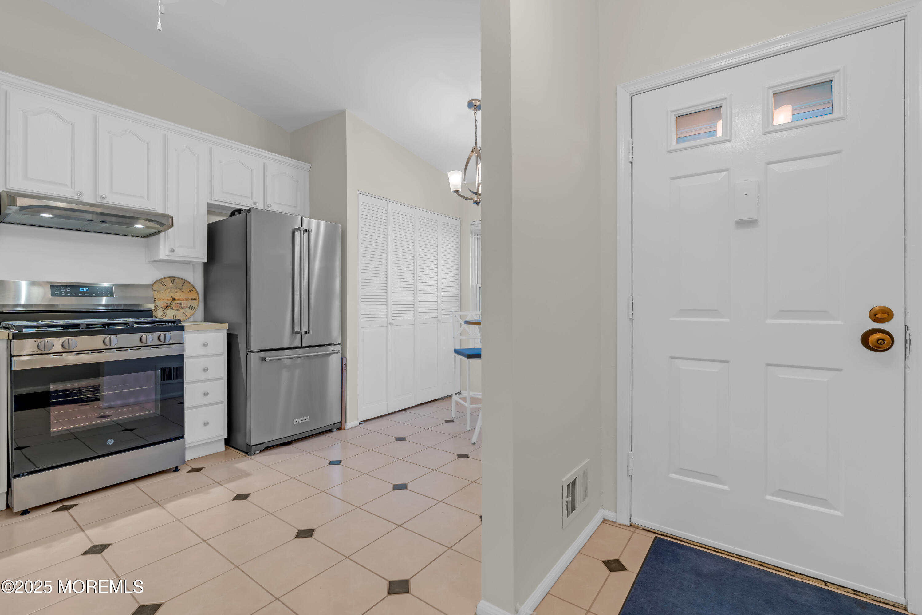 59 Boxwood Terrace Red Bank, NJ 07701 - Photo 8 of 46 a kitchen with white cabinets and stainless steel appliances