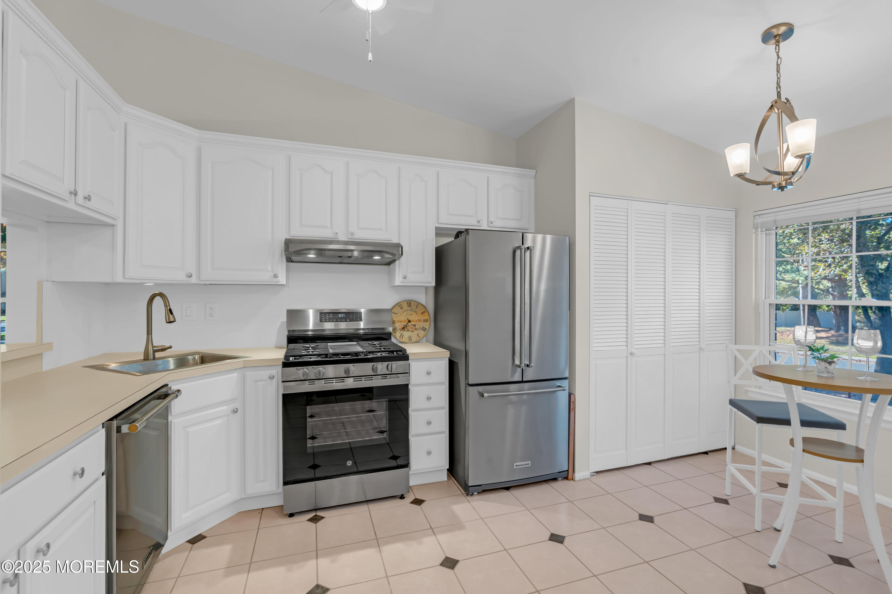59 Boxwood Terrace Red Bank, NJ 07701 - Photo 9 of 46 a kitchen with appliances a sink cabinets and a window