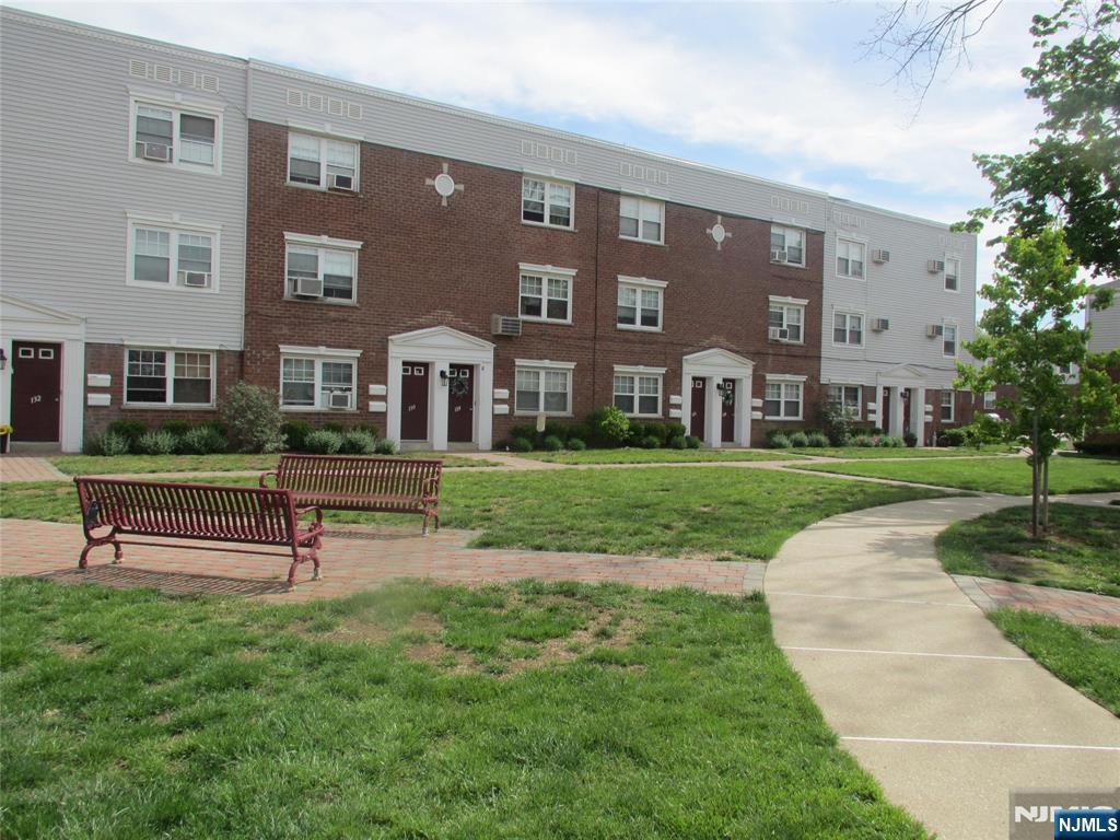 126 Hastings Avenue, Unit A Rutherford, NJ 07070 - Photo 11 of 11 a view of a brick building with a yard