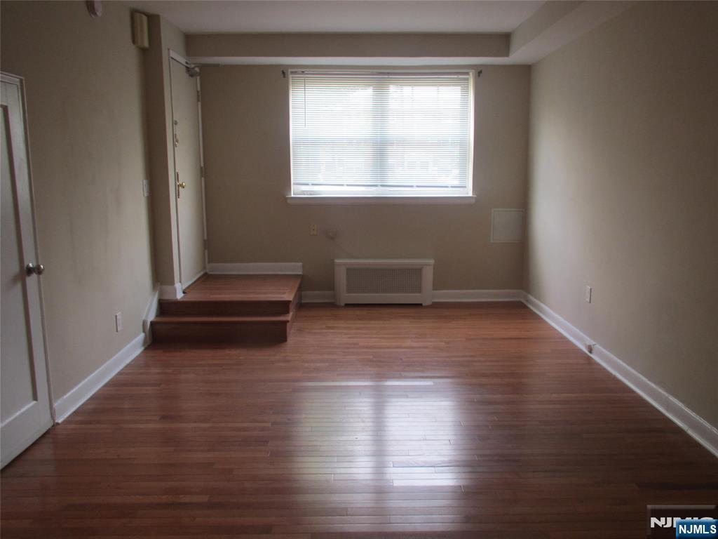 126 Hastings Avenue, Unit A Rutherford, NJ 07070 - Photo 4 of 11 a view of a room with wooden floors and window