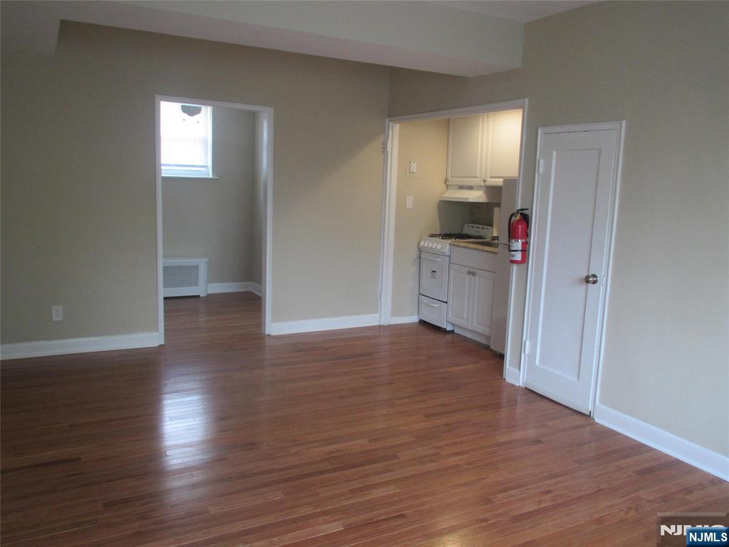126 Hastings Avenue, Unit A Rutherford, NJ 07070 - Photo 6 of 11 a view of a kitchen cabinets wooden floor and a window
