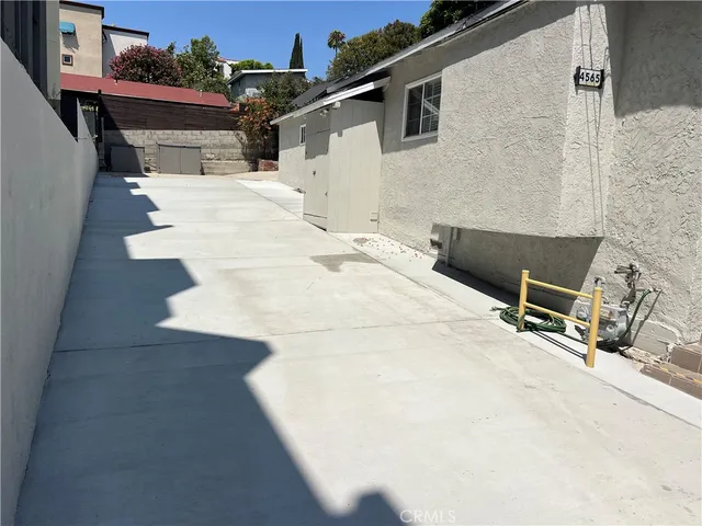 a view of a patio with a bench