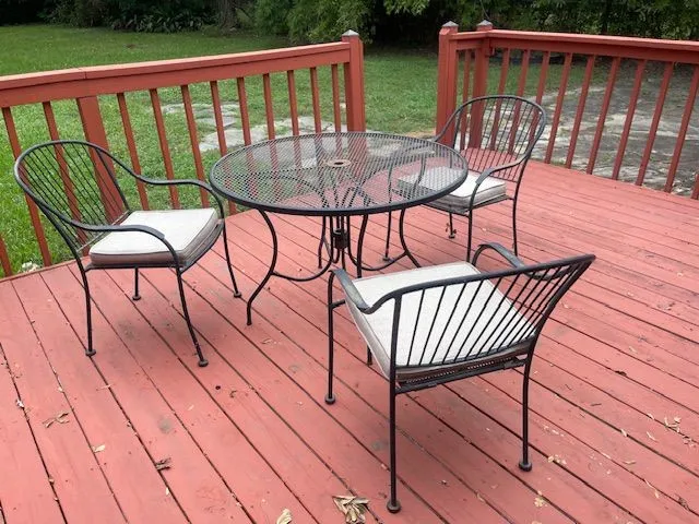 a view of a two chairs on the roof deck