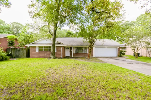 a front view of a house with a garden and porch