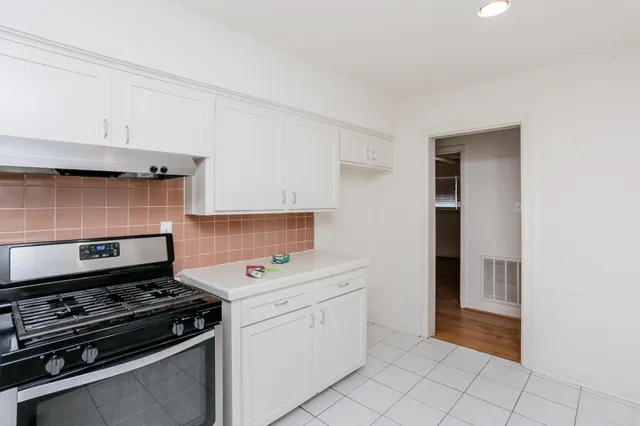 a kitchen with a stove and a microwave