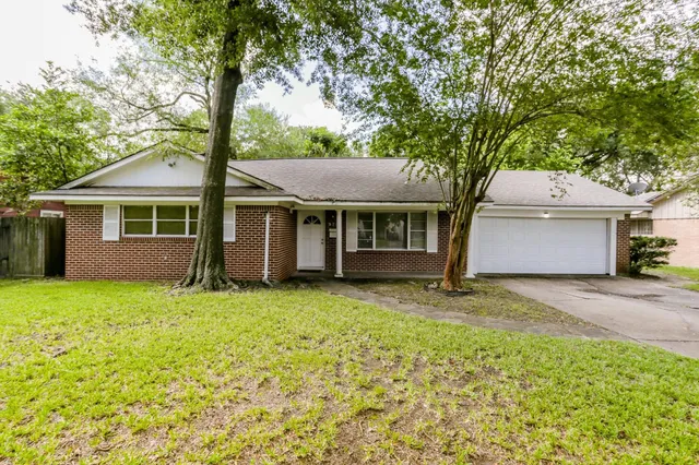 a house with trees in the background