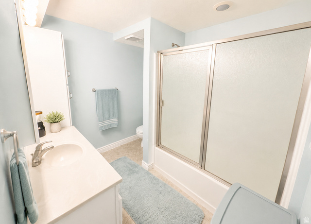 1020 Wilmar Place Centerville, UT 84014 - Photo 15 of 22 Bathroom featuring a white vanity with a single basin sink, brushed nickel faucet, and a wall-mounted medicine cabinet