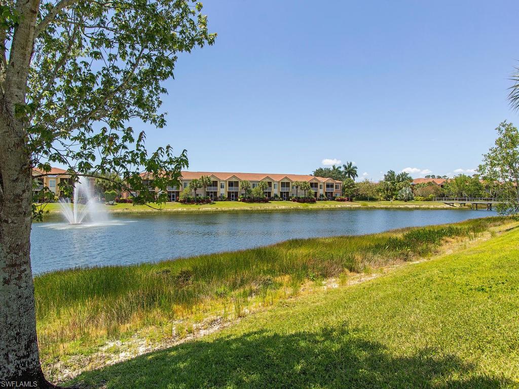 Undisclosed Address Estero, FL 33928 - Photo 12 of 14 a view of a lake with houses in the back
