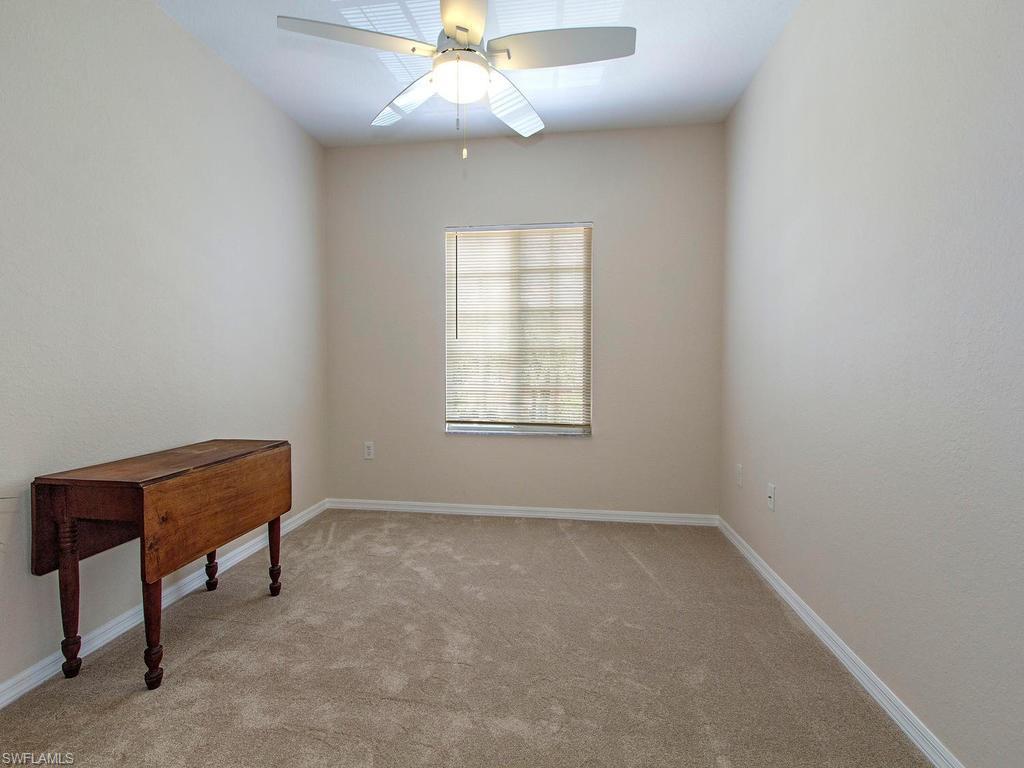 Undisclosed Address Estero, FL 33928 - Photo 9 of 14 an empty room with a window and a fan