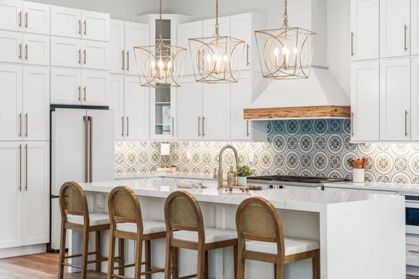 a kitchen with stainless steel appliances granite countertop a sink a stove top oven a counter space and cabinets