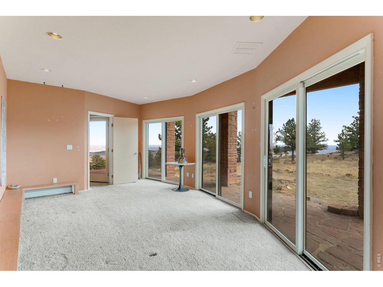 3001 Eagle Ridge Road Lyons, CO 80540 - Photo 35 of 50 a view of a big room with windows and entryway