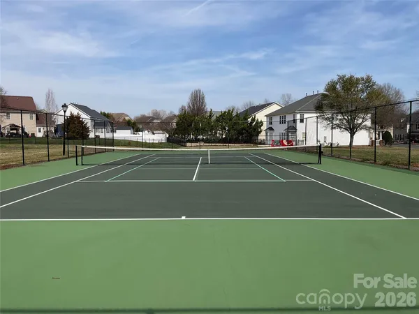 a view of tennis ground with trees