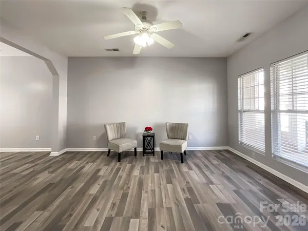 wooden floor in a room next to a window