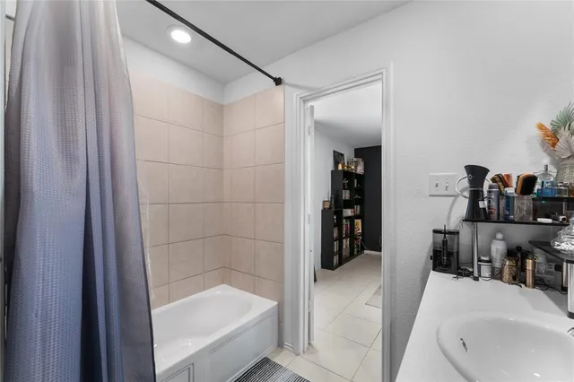 a bathroom with a bathtub and a sink