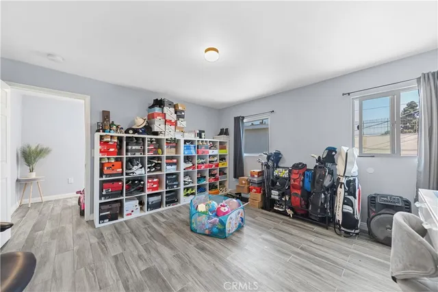 a living room with lots of furniture and wooden floor