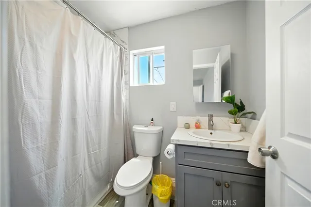 a bathroom with a sink toilet and vanity