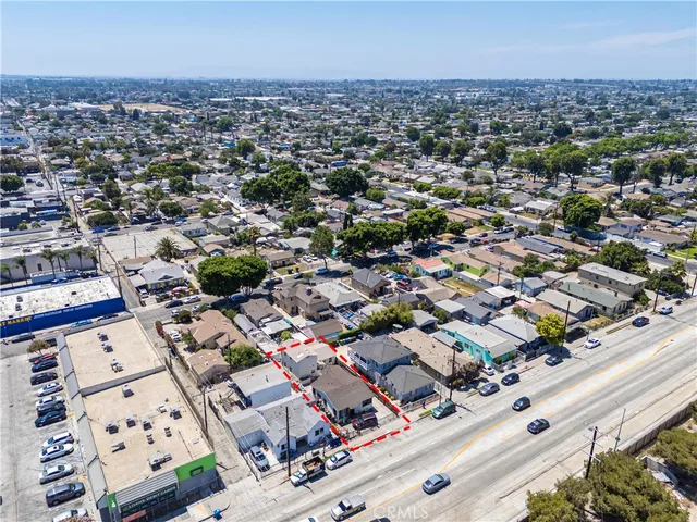 an aerial view of residential houses with city view