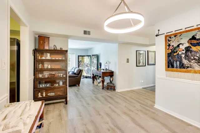 a kitchen with cabinets stainless steel appliances and a counter space