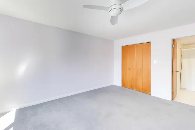 a bathroom with a sink a toilet and shower curtain
