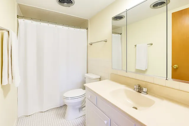 a bed room with a bed and a window