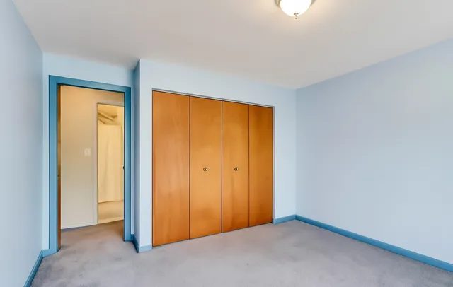 a bathroom with a sink a toilet and shower curtain