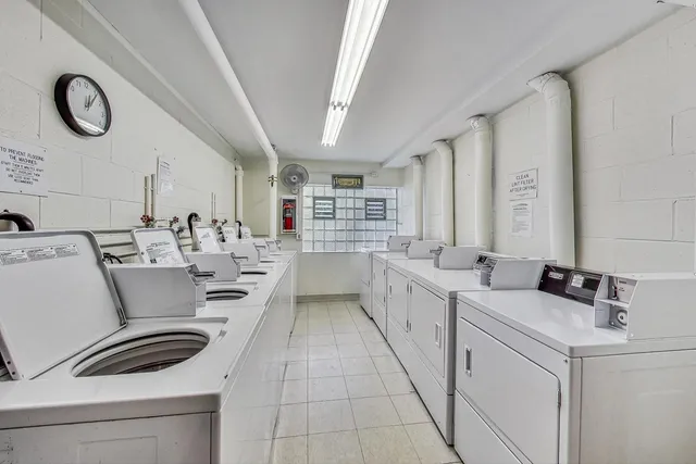 a view of a yard with swimming pool and front view of a house