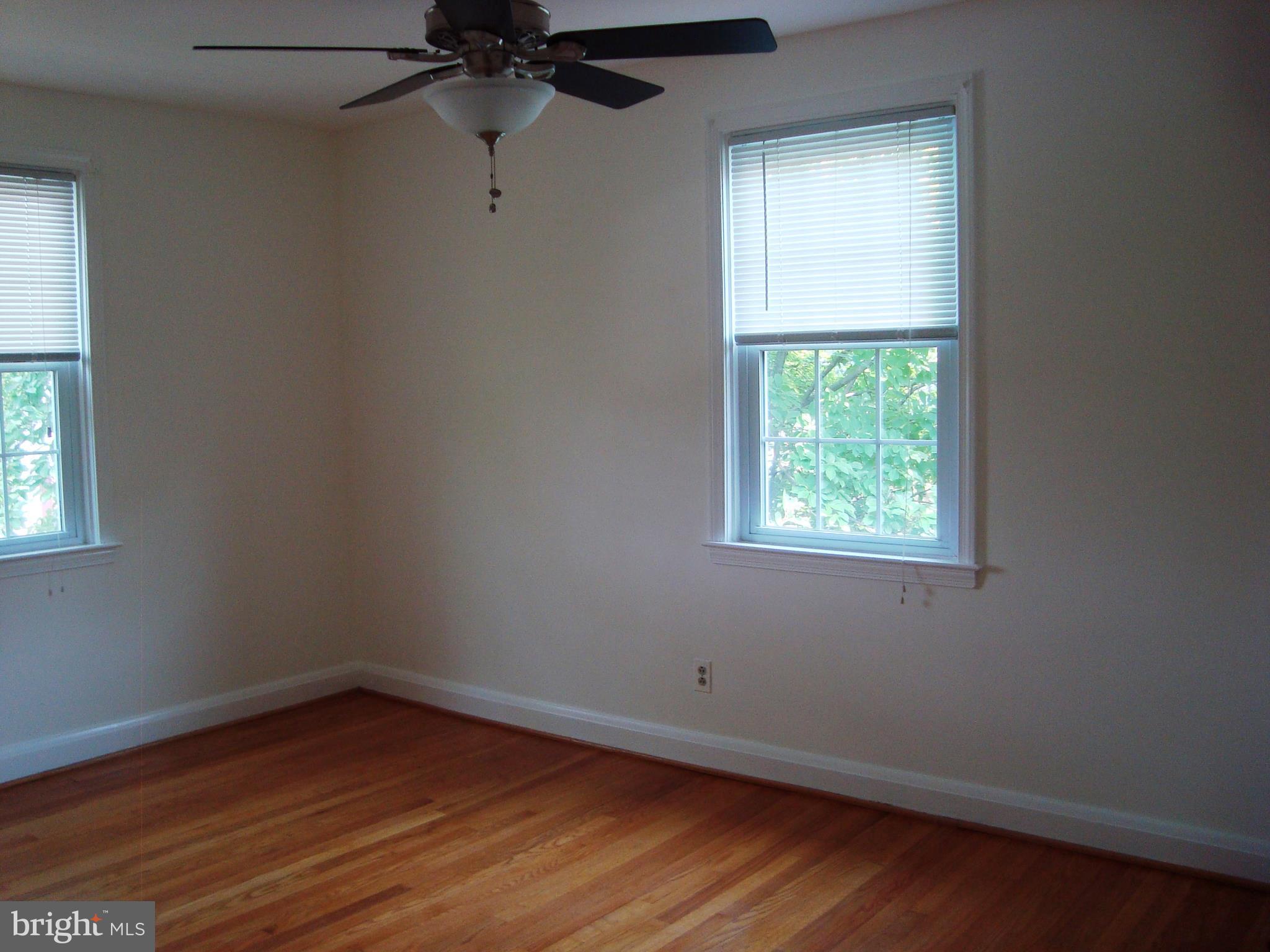 154 Brandon Road Baltimore, MD 21212 - Photo 22 of 29 Wood Floor, Ceiling Fan In Second Bedroom