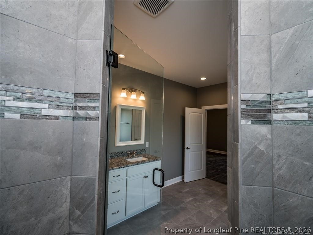 1102 West Carthage Road Lumberton, NC 28360 - Photo 25 of 41 a bathroom with a shower and a sink