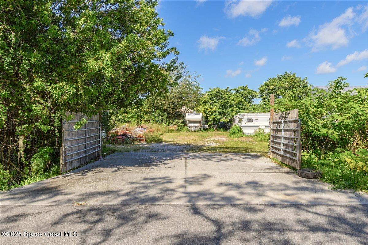 2015 Aurora Road Melbourne, FL 32935 - Photo 27 of 27 a view of a yard with plants and trees
