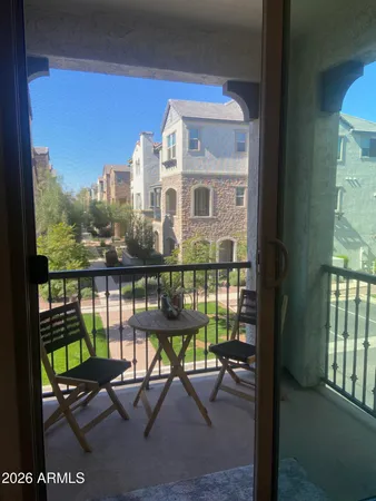 a view of a balcony with chairs