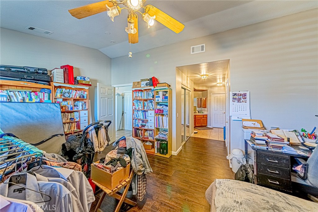 9922 Phelan Road Oak Hills, CA 92344 - Photo 12 of 30 a living room with furniture and a wooden floor